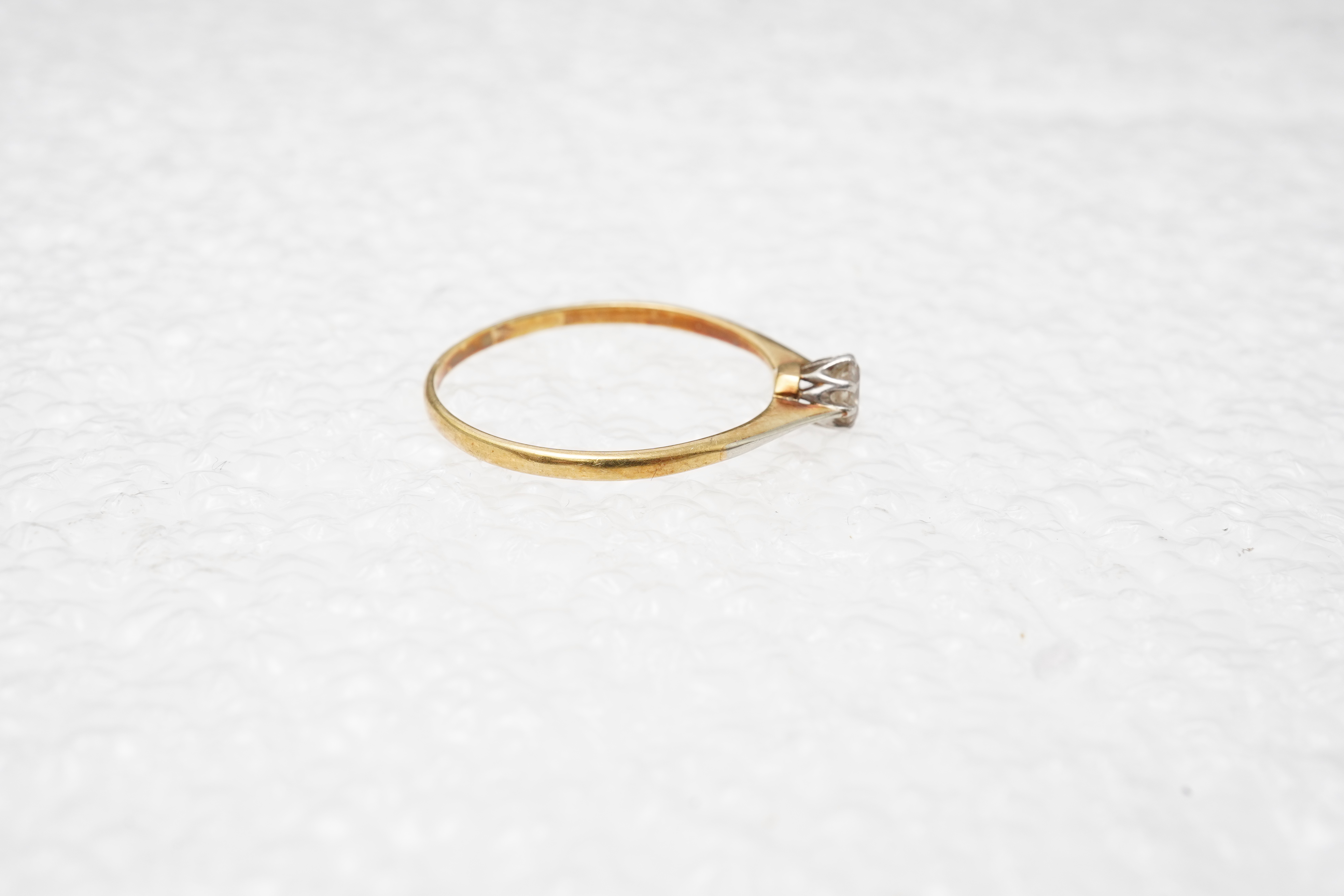 A small solitaire diamond ring, early 20th century